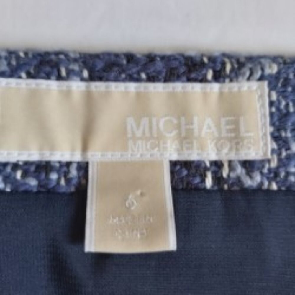 SKIRT MICHAEL KORS LABEL. DARK BLUE. WHITE FRINGE AT HEM. NEW/NO TAGS.  SIZE 6